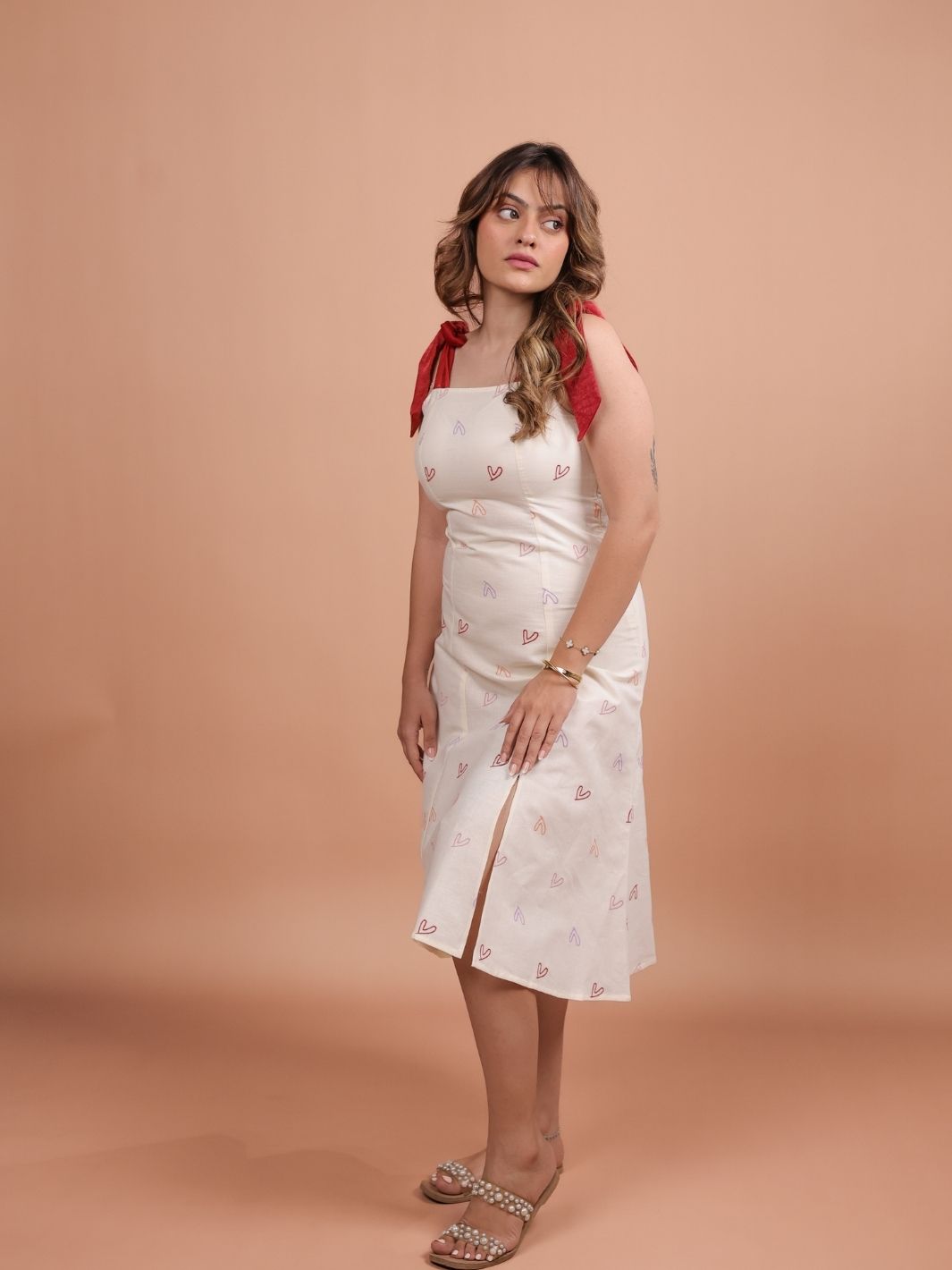 Hearts Red Bow A-line Dress for women featuring a flattering A-line silhouette, vibrant heart print design, and trendy bow detail. Perfect for casual outings, this stylish red dress adds a fun touch to your wardrobe.