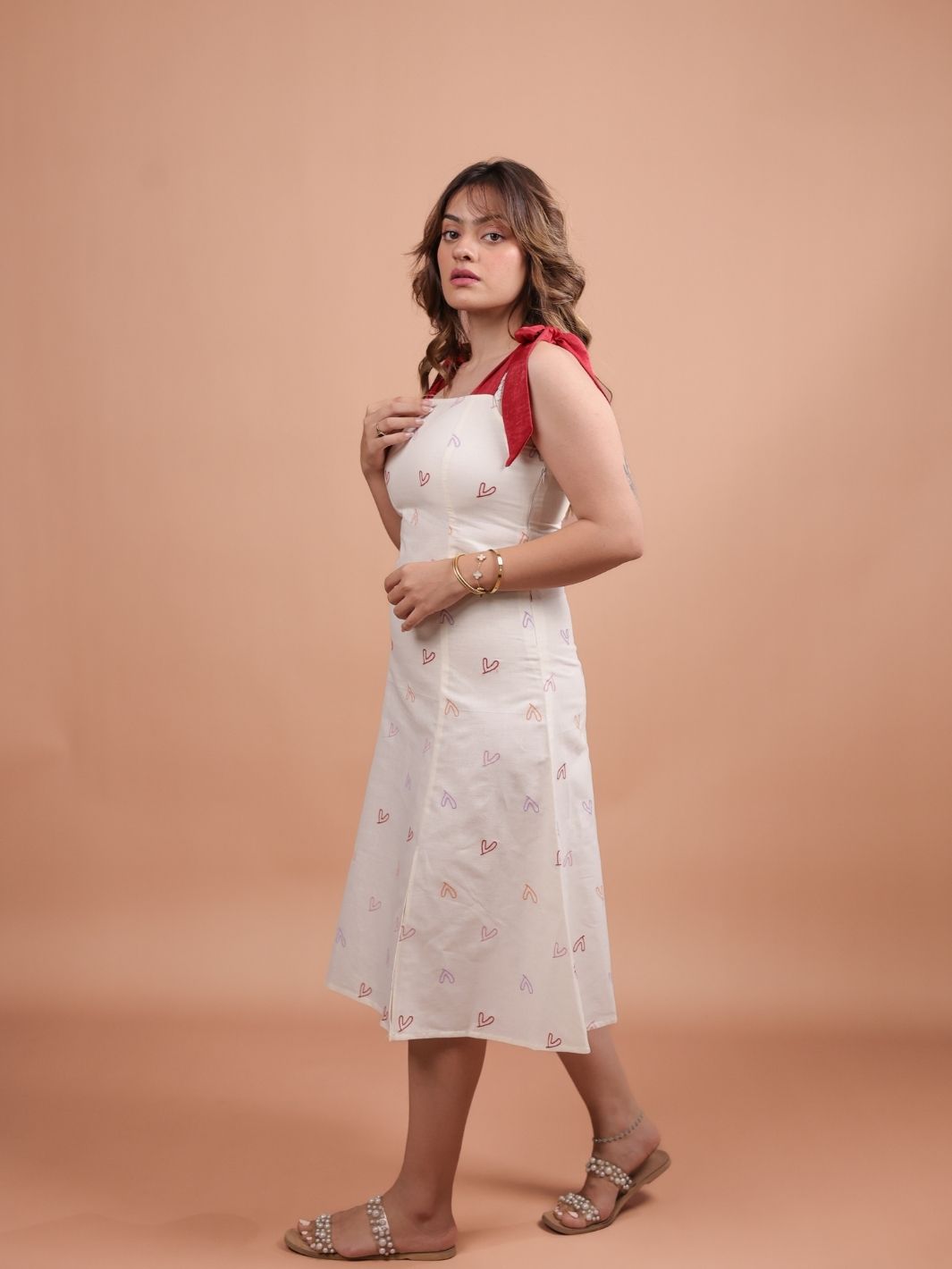 Hearts Red Bow A-line Dress for women featuring a flattering A-line silhouette, vibrant heart print design, and trendy bow detail. Perfect for casual outings, this stylish red dress adds a fun touch to your wardrobe.