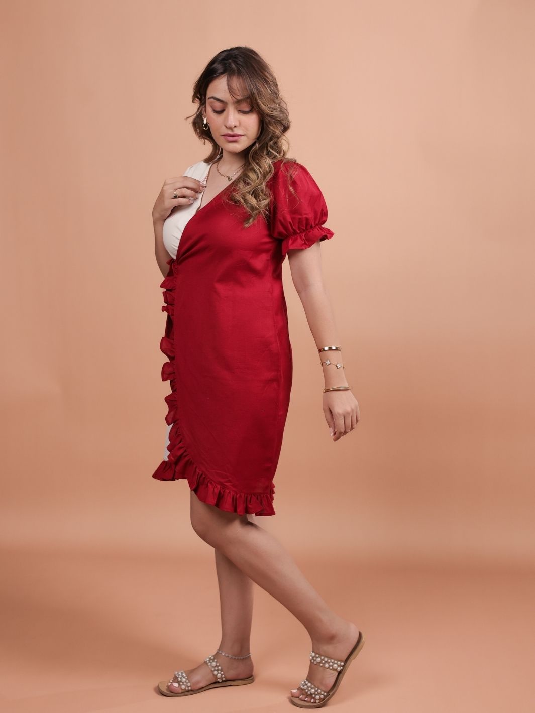 Hearts Red Ruffle Wrap Dress featuring a playful heart print, flattering ruffle design, and adjustable wrap closure.