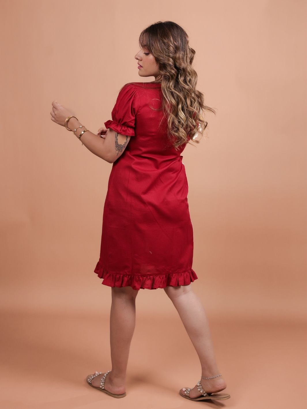 Hearts Red Ruffle Wrap Dress featuring a playful heart print, flattering ruffle design, and adjustable wrap closure.