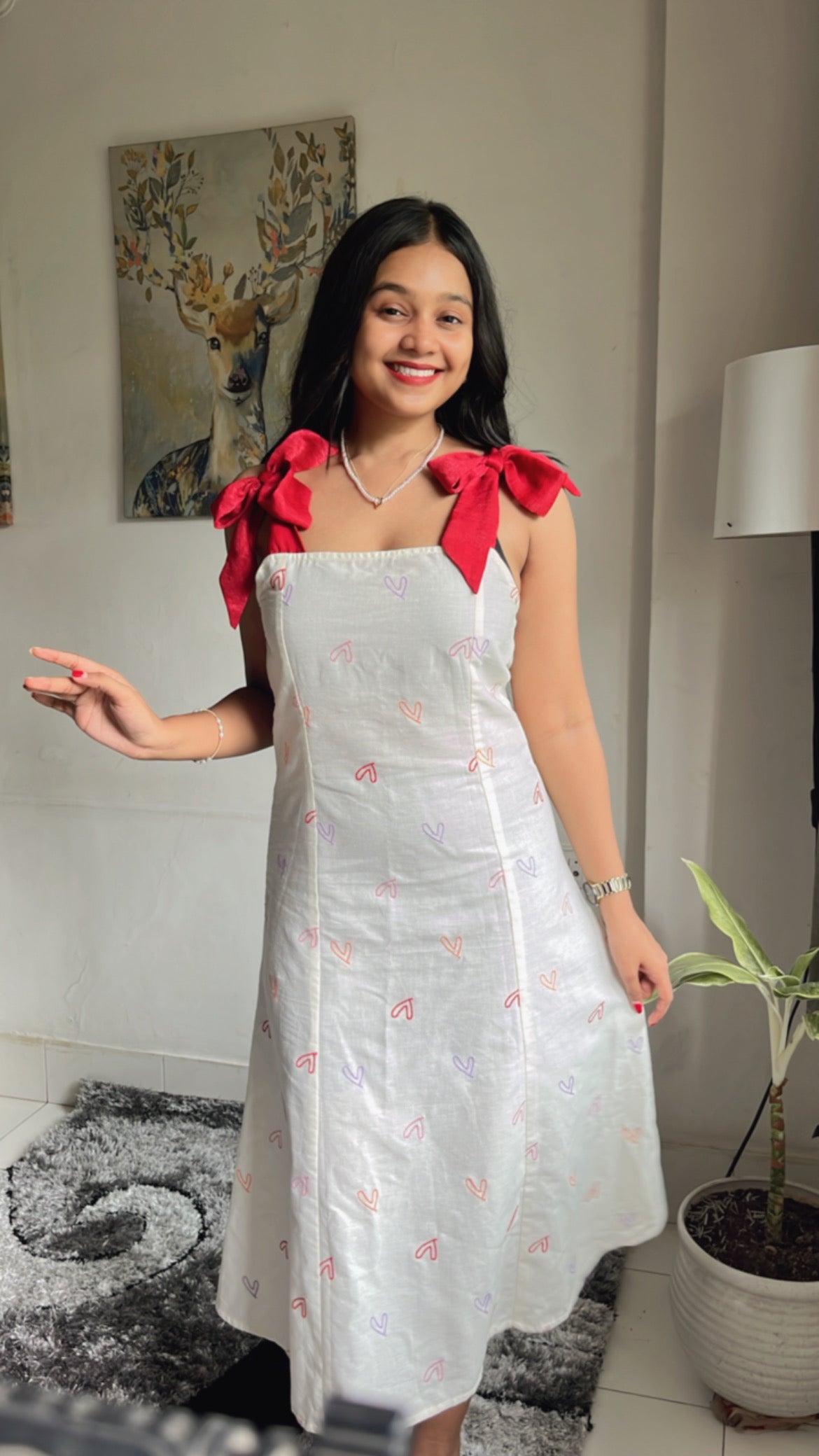 Hearts Red Bow A-line Dress for women featuring a flattering A-line silhouette, vibrant heart print design, and trendy bow detail. Perfect for casual outings, this stylish red dress adds a fun touch to your wardrobe.