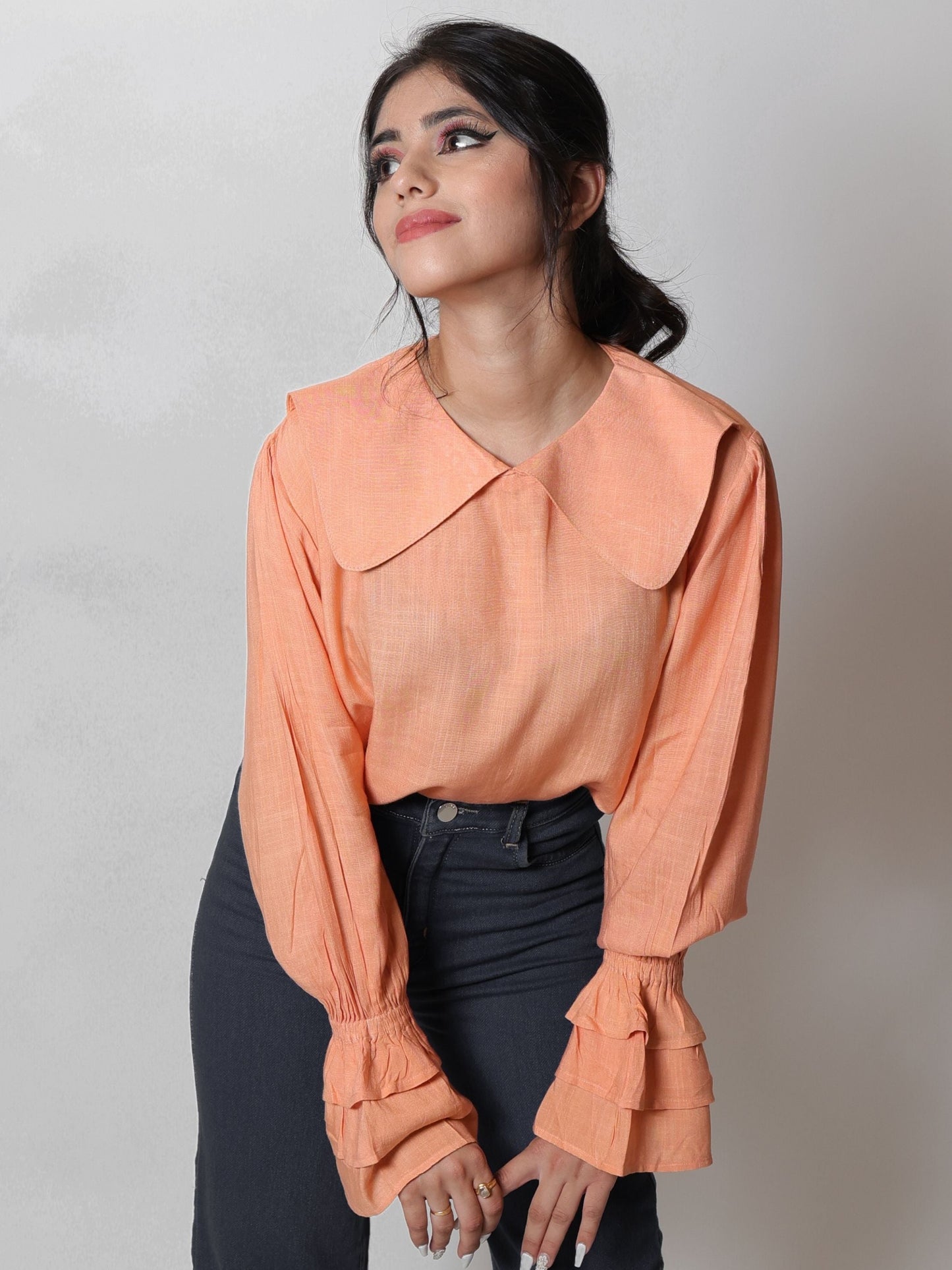 Coral Peach Long Blouse Top featuring a flowy design and vibrant coral peach color, ideal for layering or wearing alone. Perfect for both casual outings and formal events, this blouse combines elegance with comfort.