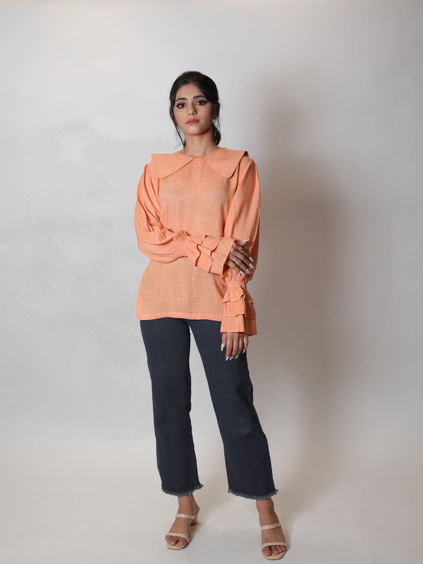 Coral Peach Long Blouse Top featuring a flowy design and vibrant coral peach color, ideal for layering or wearing alone. Perfect for both casual outings and formal events, this blouse combines elegance with comfort.