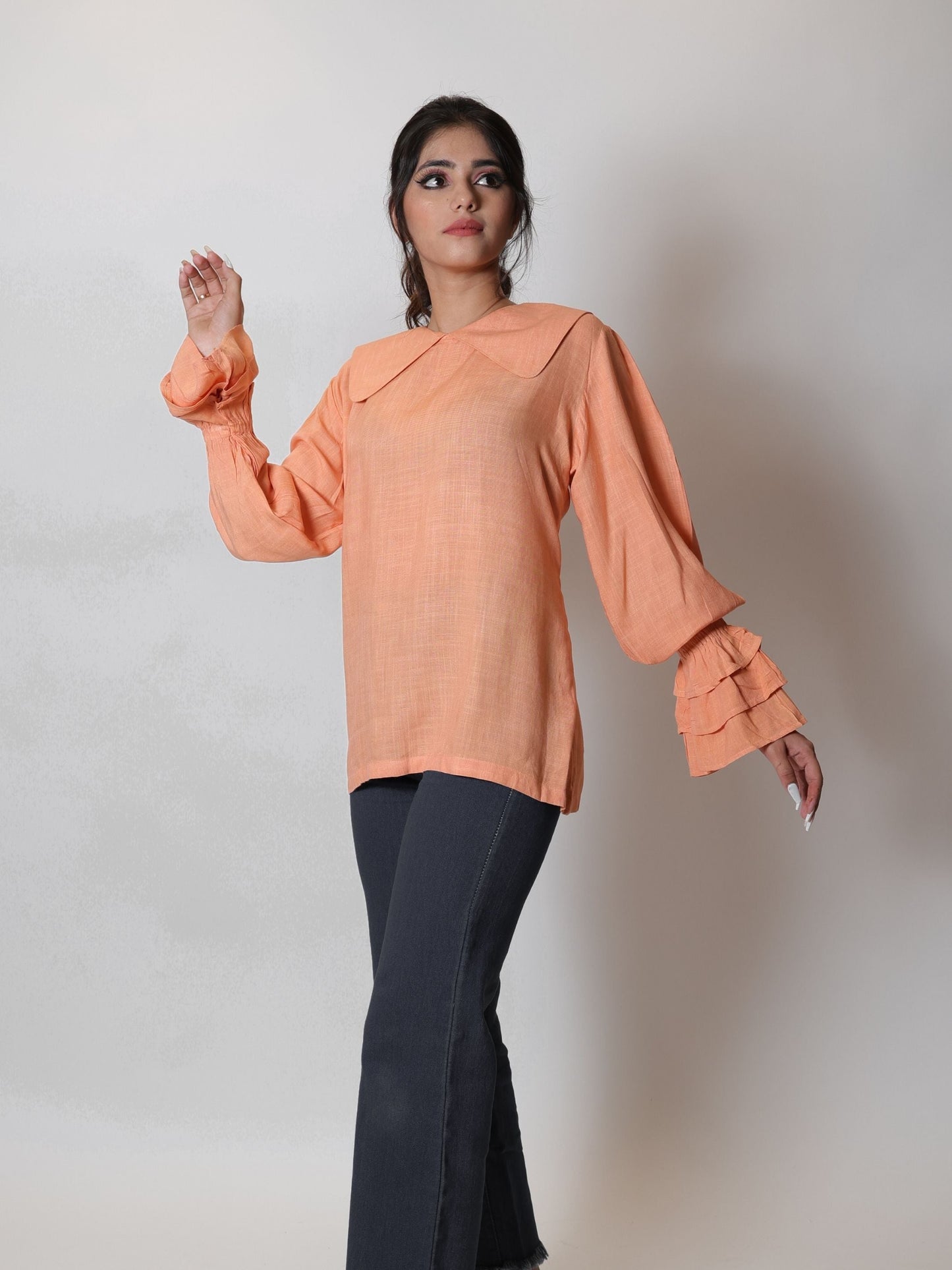 Coral Peach Long Blouse Top featuring a flowy design and vibrant coral peach color, ideal for layering or wearing alone. Perfect for both casual outings and formal events, this blouse combines elegance with comfort.