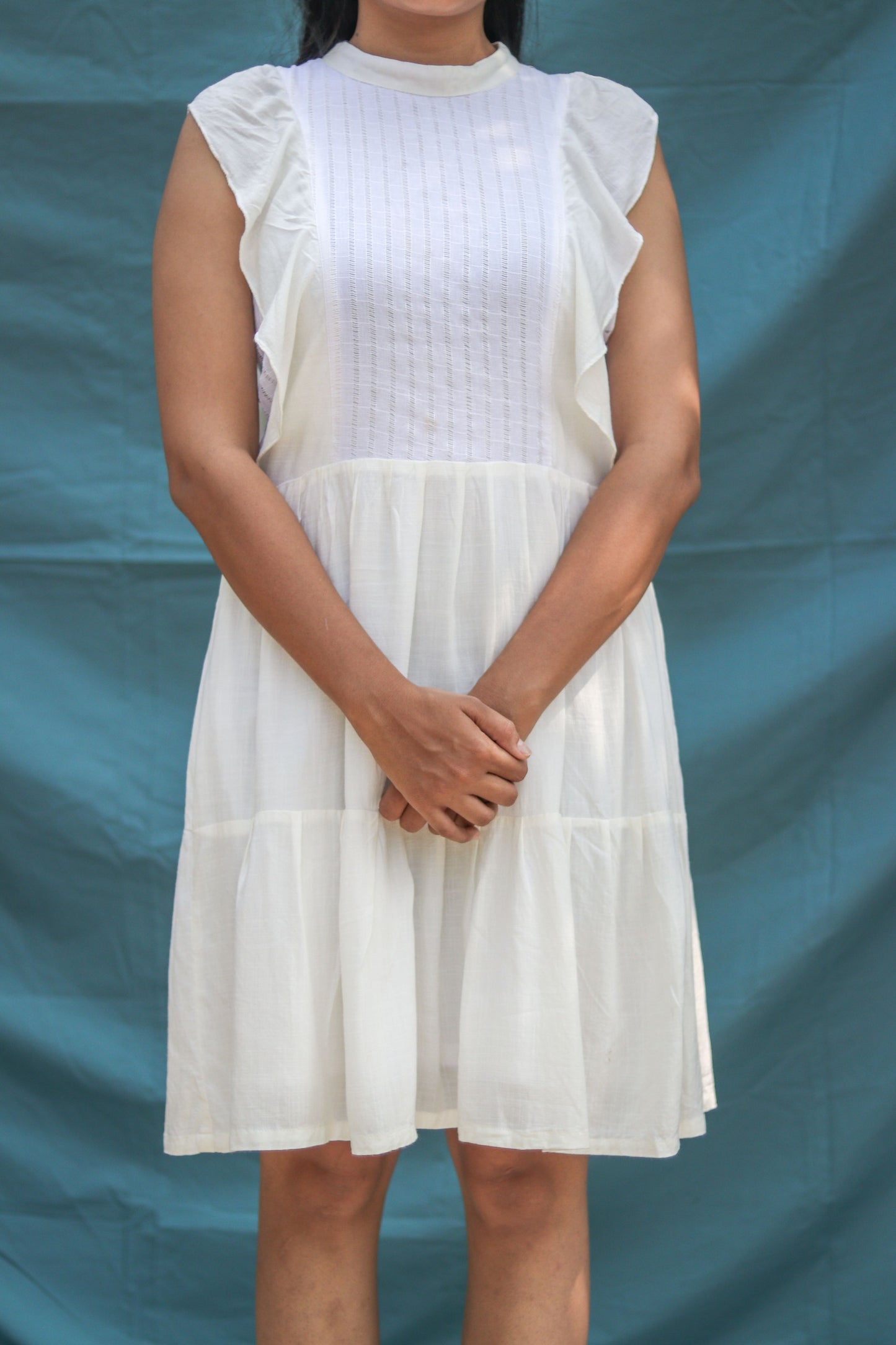 Cream Ruffle Round Dress featuring delicate ruffle details and a flattering round neckline, ideal for summer parties, garden events, or everyday wear. This stylish dress combines comfort and elegance, making it a must-have for your wardrobe.
