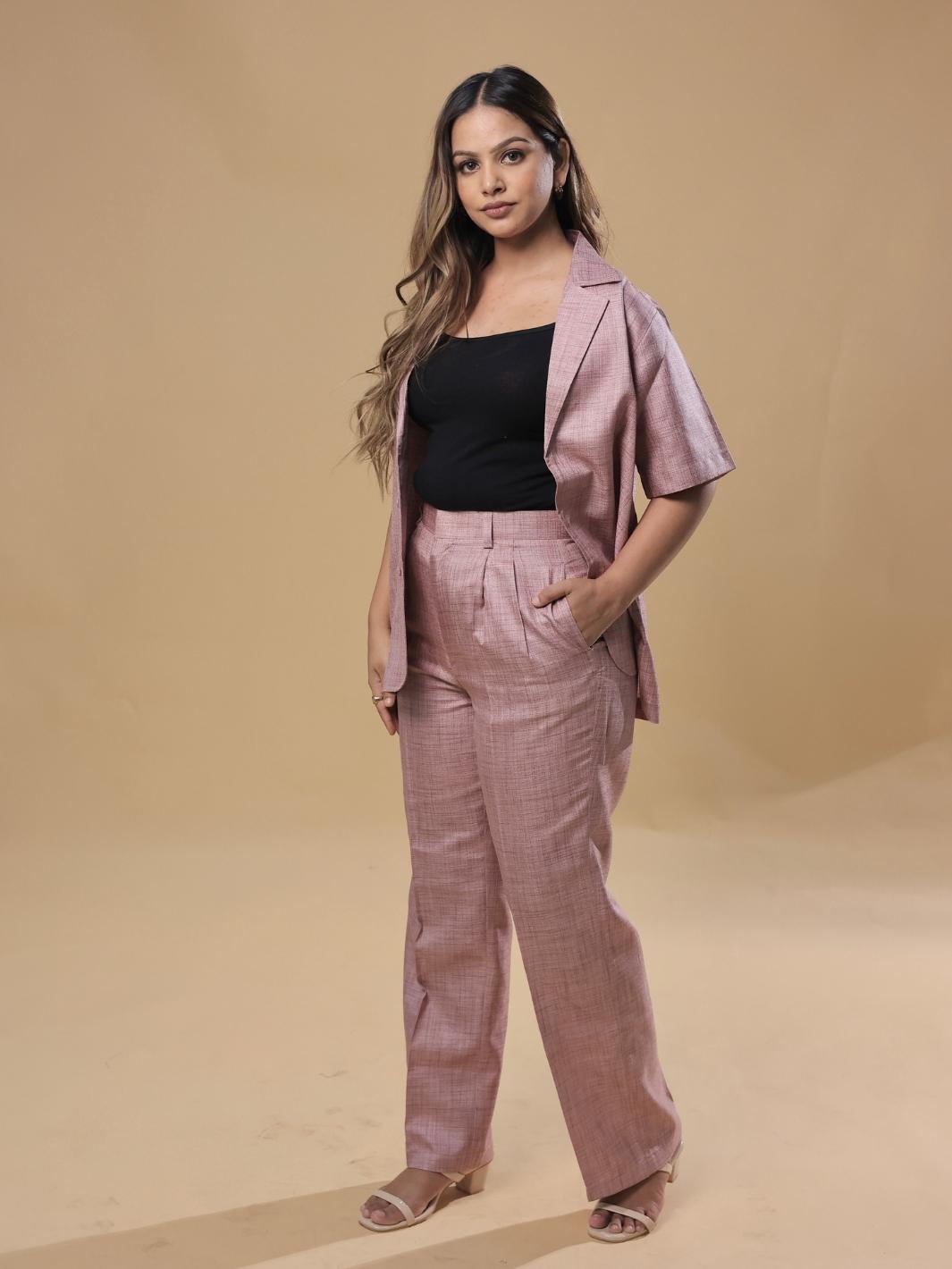 City Girl Pink Coat Pant Co-Ord Set featuring a stylish pink coat and matching pants, perfect for urban outings and sophisticated casual looks. This fashionable two-piece set is designed for women who embrace modern style.